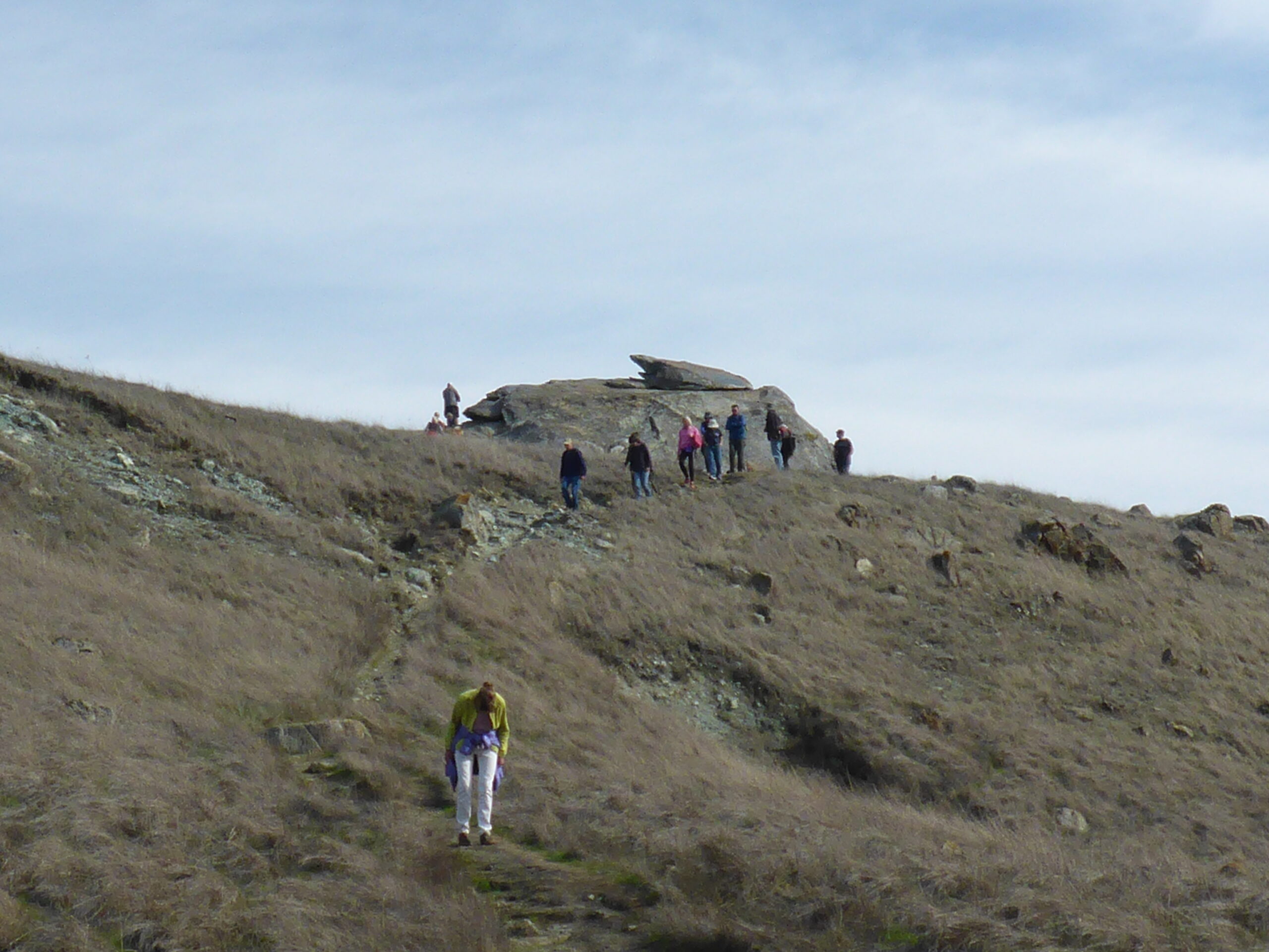 Photo showing a group of hikers on a trail.